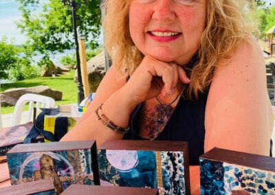 Image of Stephanie Katrina with her mixed media artwork.
